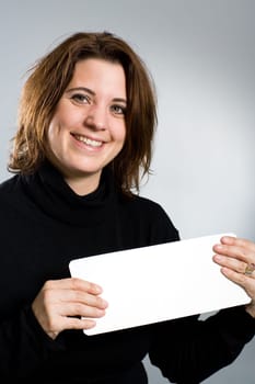 Woman holding blank card