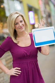 Woman with blank white sign for text