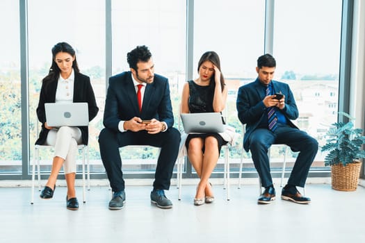 Job seekers and applicants waiting for interview on chairs in office. Job application and recruitment interview qualification concept. Jivy