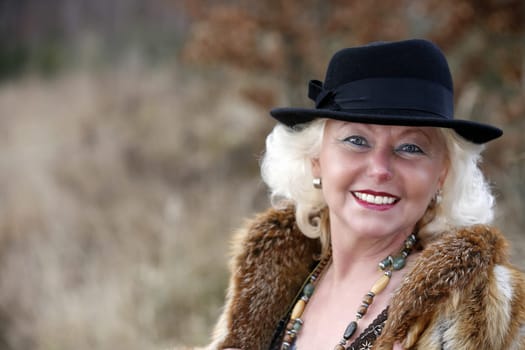white-haired woman late 50's
