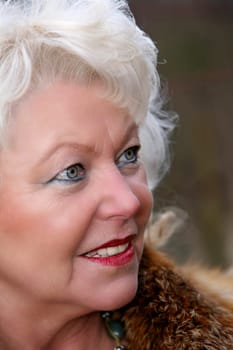 white-haired woman late 50's