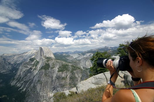 Woman taking pictures at Glacier Point