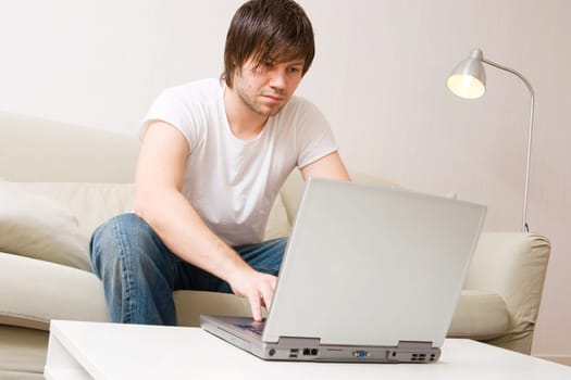 young businessman doing work at home