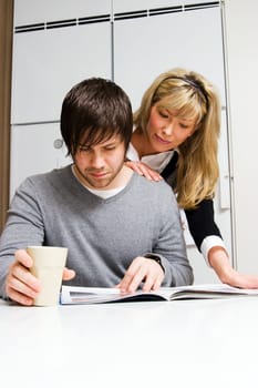 couple reading magazine