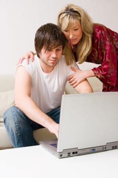 Young couple using a laptop computer