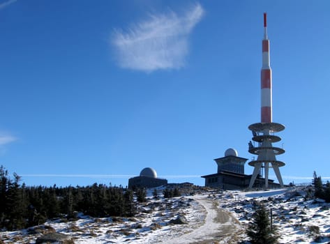 The radio tower on the Brocken. At 1142 m,the Brocken is the highest mountain in the northern German low mountain range. In GDR times,this mountain was closed to visitors. It was used for broadcasting and "listening"". Now he is happy to hike again o"