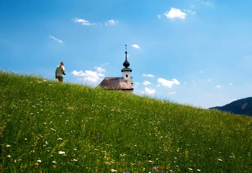 Summer meadow with chapel
