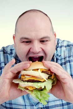 Man with cheeseburger