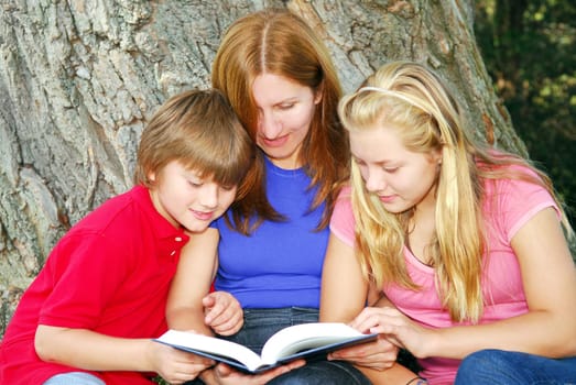 Family reading a book