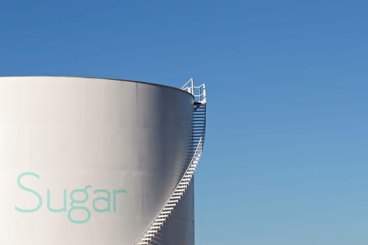 sugar silo against blue sky