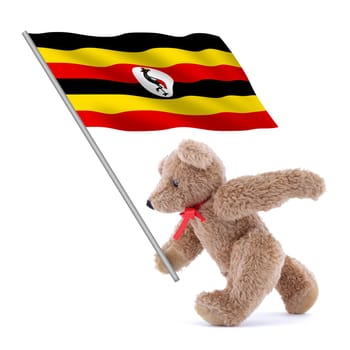 A Uganda flag being carried by a cute teddy bear