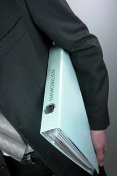 Businessman with real estate folder