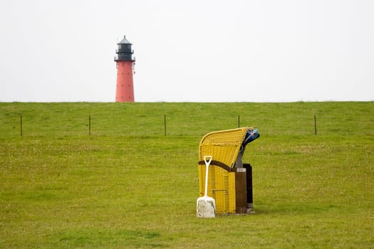 Beach chair and lighthouse