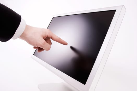 finger pointing at monitor