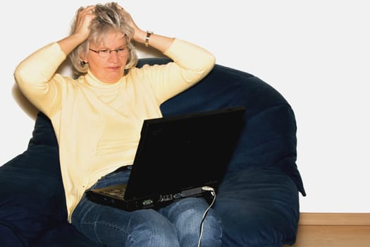 Woman with laptop pulls her hair out -