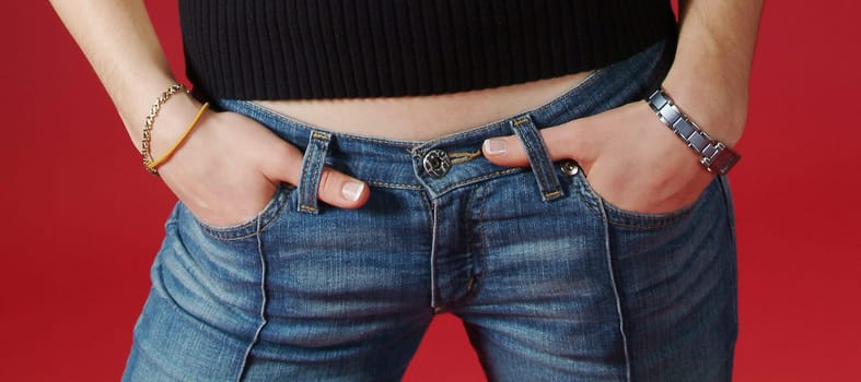 teen abdomen with hands in pockets