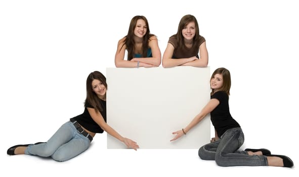 4 teen girls surrounding blank sign