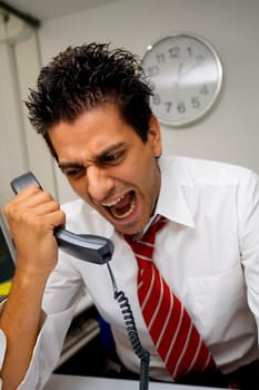 businessman screaming on the phone