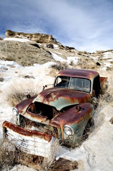 abandoned car in snow