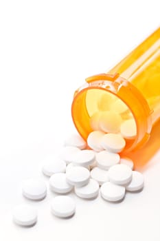 pills with bottle on white