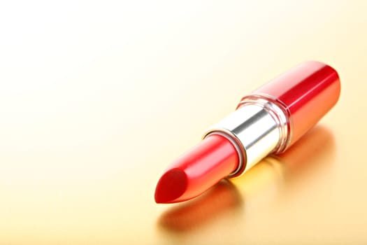 lipstick closeup golden background
