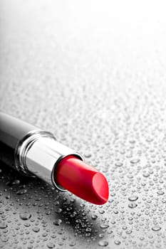 lipstick closeup with desatured water dr