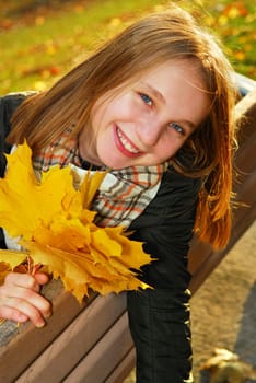 Girl with maple leaves