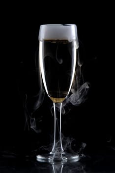 Glass of wine isolated over black background