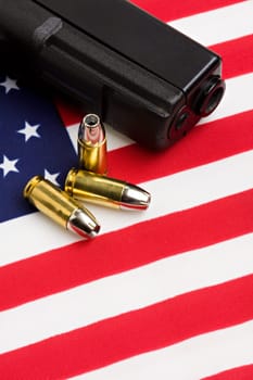 gun and bullets on flag