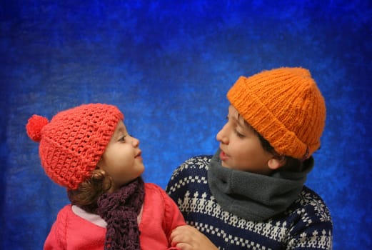 Brother and sister having fun in winter