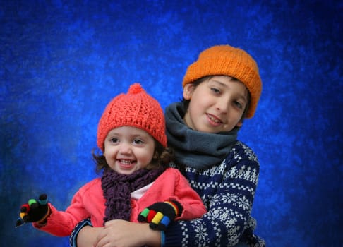 Brother and sister having fun in winter