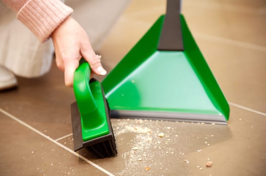 Housewife sweeping dirt