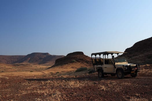 Land Rover in front of landscape panorama
