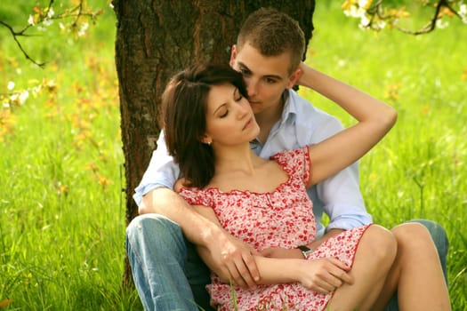 Happy kissing couple in the park