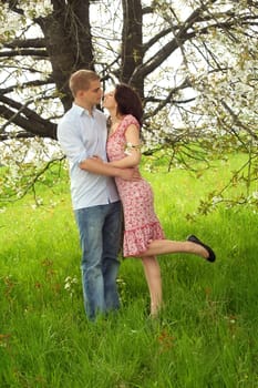 Happy kissing couple in the park