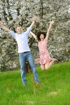 Happy couple jumping