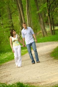 Happy couple in the park while walking