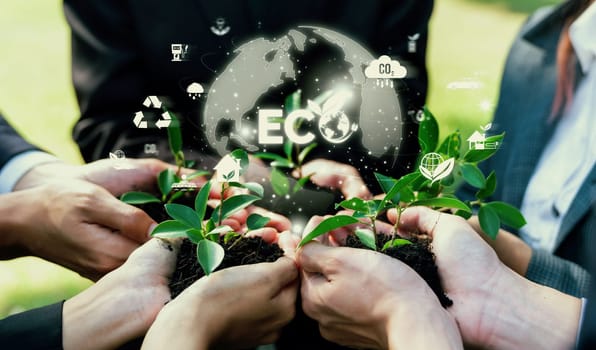 Business partnership nurturing or growing plant together with eco friendly icon symbolize ESG sustainable environment protection by eco technology and carbon reduction for net zero future. Reliance