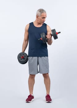 Full body length shot active and sporty senior man lifting dumbbell during weight training workout on isolated background. Healthy active physique and body care lifestyle for pensioner. Clout