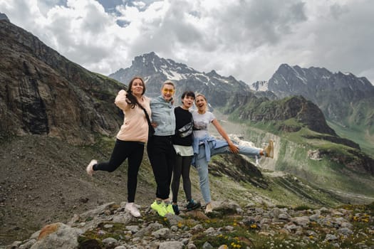 A group of girlfriends climbed high in the mountains