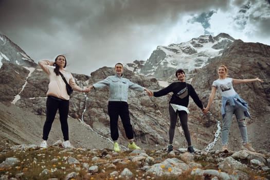 A group of girlfriends climbed high in the mountains