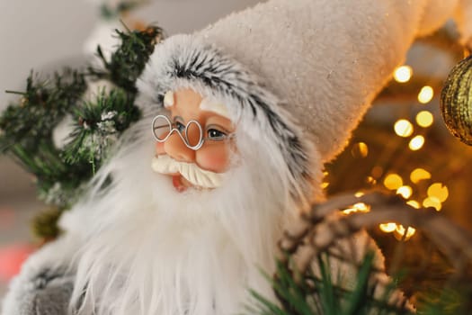 Christmas decorations Santa Claus standing under the Christmas tree