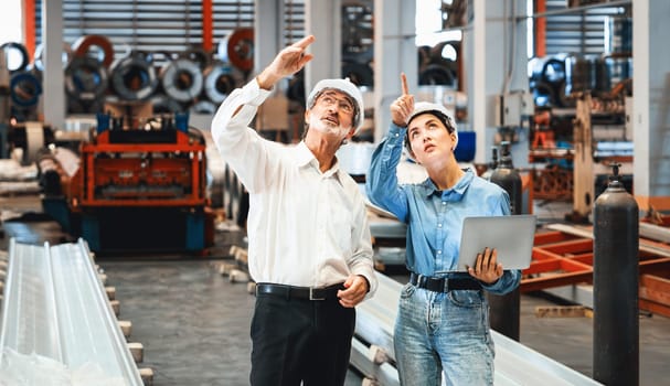 Factory manager or executive make visit metalwork manufacturing factory tour and inspect heavy steel industrial machinery showcase leadership quality as engineering inspection supervisor. Exemplifying