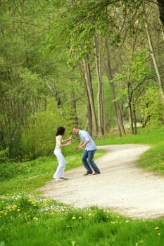 Happy couple in the park running