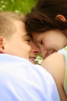 Happy couple on a meadow
