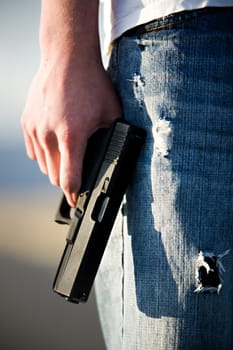 teen with handgun