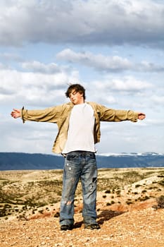 teen with arms wide open