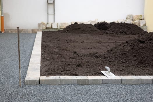 Earth,trowel and gravel bed