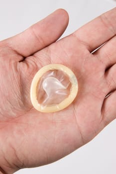 hand holding condom