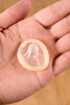 hand holding condom